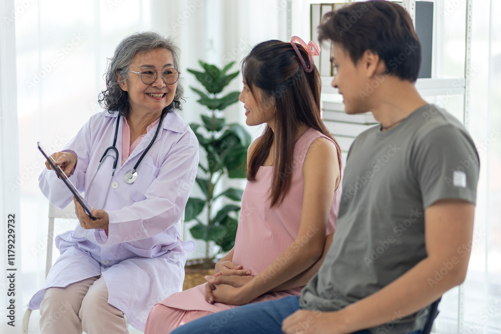 Pregnant Couple Consulting with Expert Doctor during a prenatal checkup Pregnant Couple Consulting with Expert Doctor during a prenatal checkup
