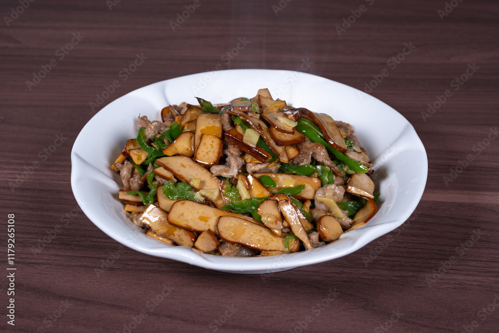 Shredded pork with green pepper and dried beans on a plate Shredded pork with green pepper and dried beans on a plate