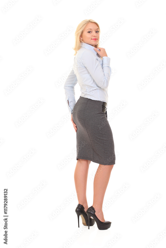 Blonde woman in office outfit: light blue shirt, gray pencil skirt, black belt Blonde woman in office outfit: light blue shirt, gray pencil skirt, black belt