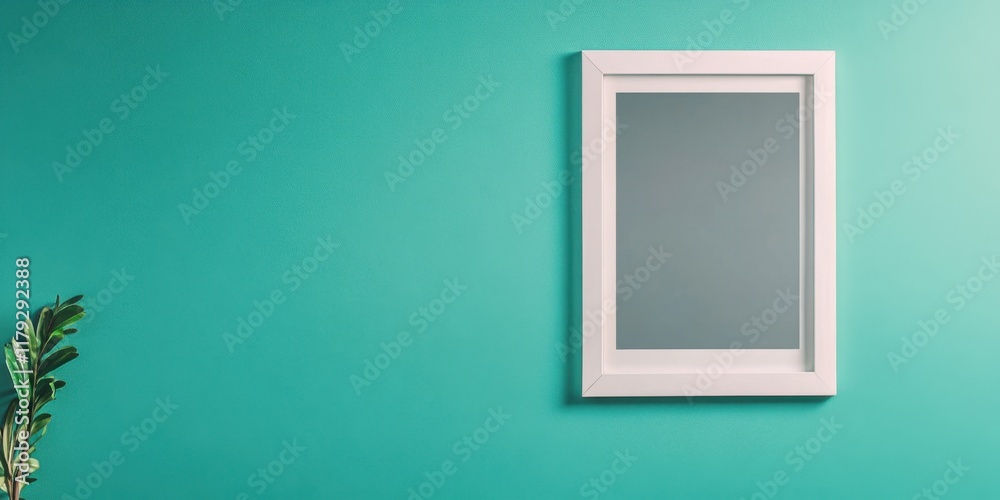 A Minimalist Mirror Placed on a Teal Wall with a Striking Green Plant Nearby for Effect A Minimalist Mirror Placed on a Teal Wall with a Striking Green Plant Nearby for Effect