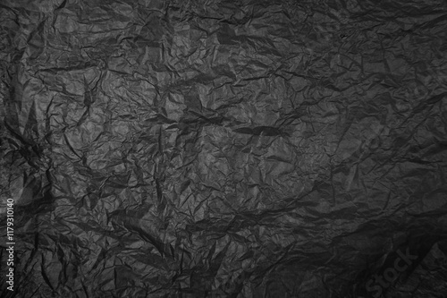 Plastikfolie in schwarz als zerknitterter Hintergrund