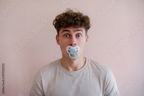 Man with a pacifier in his mouth.