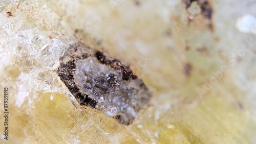 macrophotography of the surface of beryl heliodor with inclusion photo