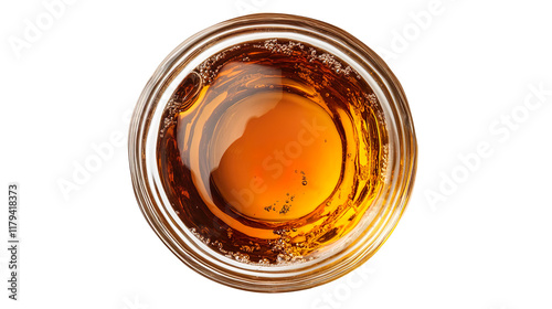 A top view of a clear glass bowl filled with amber-colored liquid, isolated on a white background.