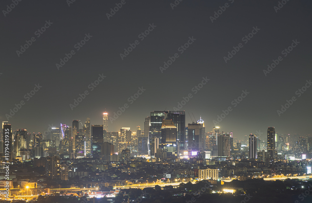Nightscape view after sunset of Skyscrapers in the business district of downtown in the Bangkok city. City night view of Modern buildings after sunset with bright glowing lights, Space for text.