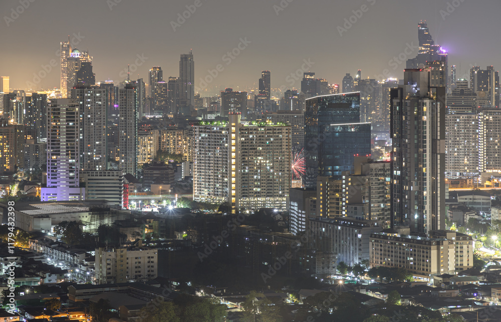 Nightscape view after sunset of Skyscrapers in the business district of downtown in the Bangkok city. City night view of Modern buildings after sunset with bright glowing lights, Space for text.