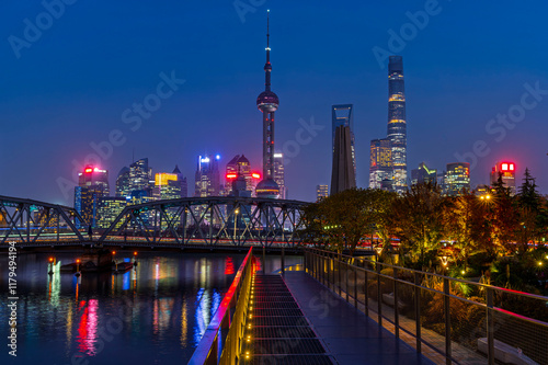 Sunset of Shanghai city modern skyscraper night light cityscape in twilight  blue sky in  autumn season behind pollution haze, view from the bund in Shanghai, China. photo