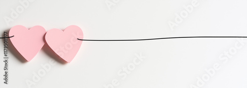 Cute Cartoon Style Connected Pink Hearts Clip Art, Simple Line Drawing on White Background, Minimalist Illustration for Children's Books and Decor.