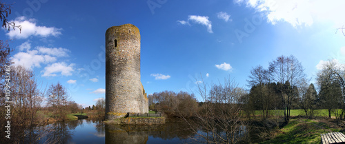 Medieval ruin of Baldenau castle with its tower and moat in early spring photo