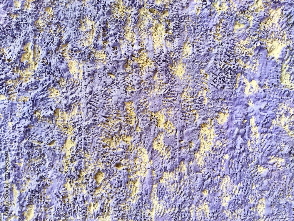 Fototapeta premium Textured wall with a unique pattern and vivid colors ideal for background design or creative projects