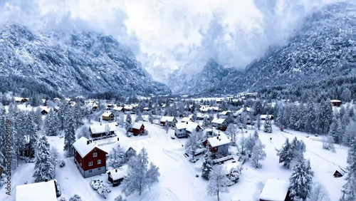 Winter Wonderland: Aerial View of a Nordic Village in Snow
