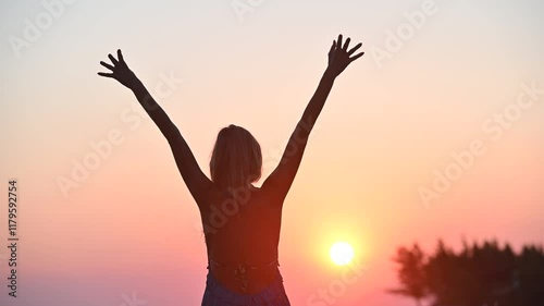 Video of a young woman enjoying life at summer sunrise