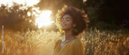 Young Woman Basking in Golden Hour Light in Nature Setting