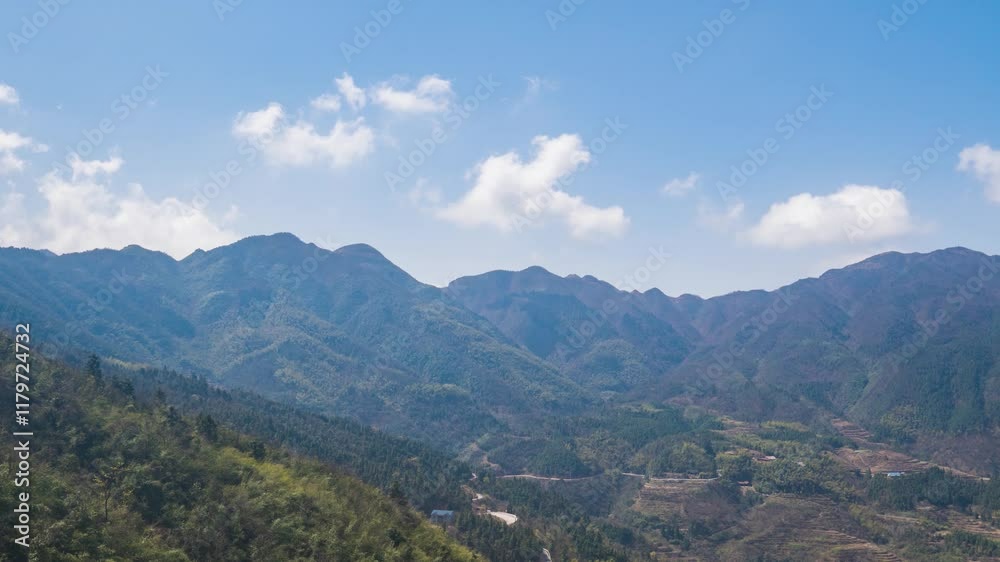 Majestic mountains under a blue sky with white clouds captured in a stunning time lapse from a scenic viewpoint Majestic mountains under a blue sky with white clouds captured in a stunning time lapse from a scenic viewpoint