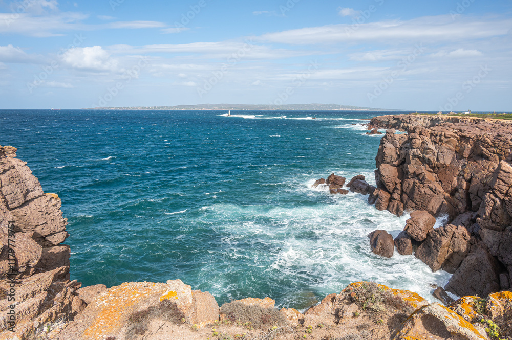 The beautiful high red cliffs of Nido dei Passeri on the island of Sant'Antioco in Sardinia