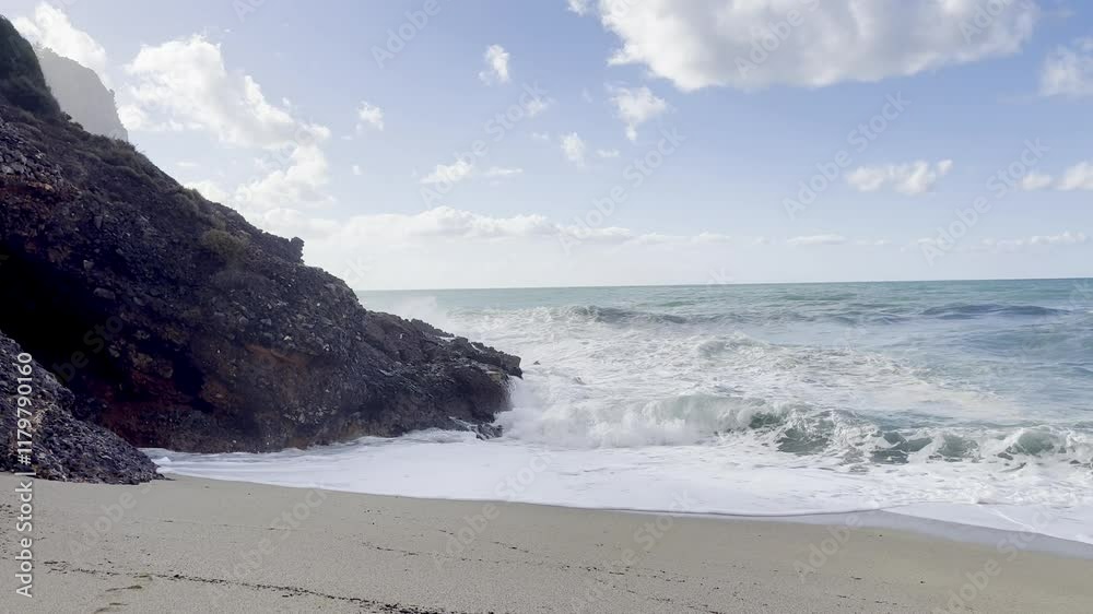Drone view of sea waves and foam rock sandy beach. High quality 4k footage Drone view of sea waves and foam rock sandy beach. High quality 4k footage