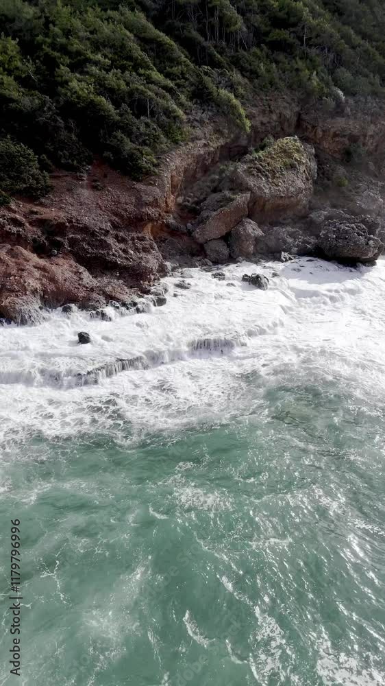 Drone view of sea waves and foam rock sandy beach. High quality 4k footage Drone view of sea waves and foam rock sandy beach. High quality 4k footage