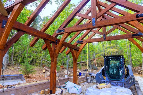 Wallpaper Mural Wooden framework is being built gazebo in forest, with construction equipment, supplies visible. Torontodigital.ca