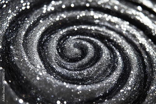 Silver Glitter shiny swirl. A shiny, swirling pattern of silver glitter, perfect for festive themes or luxurious design accents.
