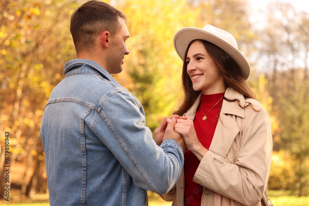 Happy couple spending time together in autumn park Happy couple spending time together in autumn park
