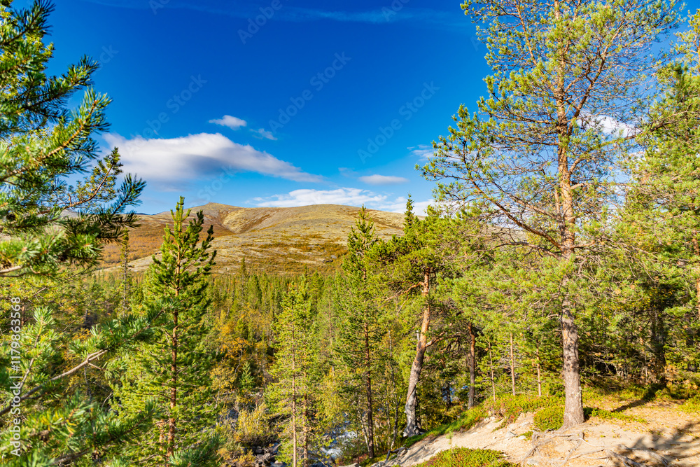 View to Khibiny mountains near Chasnayok creek. Early autumn in arctic tundra region. Kola peninsula, Murmansk region, Russia.
