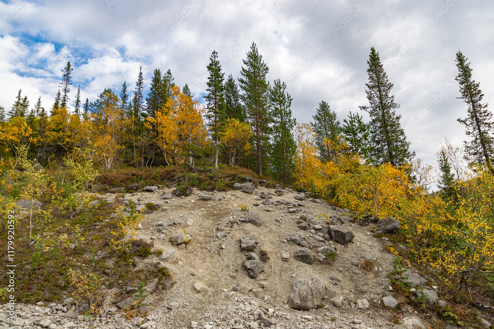 View to Khibiny mountains near Mannepakhp river. Early autumn in arctic tundra region. Kola peninsula, Murmansk region, Russia.