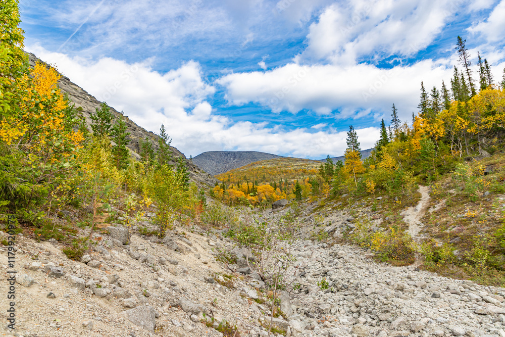 View to Khibiny mountains near Mannepakhp river. Early autumn in arctic tundra region. Kola peninsula, Murmansk region, Russia.