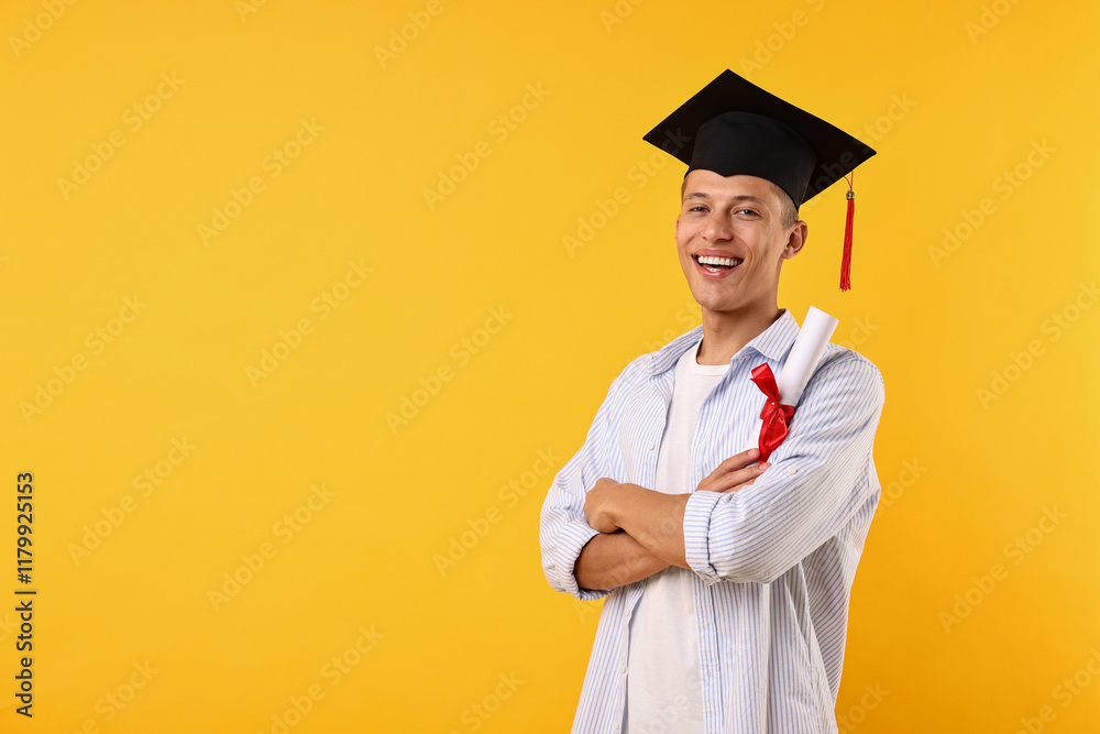 Happy student with diploma after graduation on orange background. Space for text Happy student with diploma after graduation on orange background. Space for text