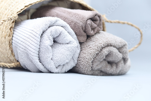 Closeup natural cotton towels on grey background with copyspace.