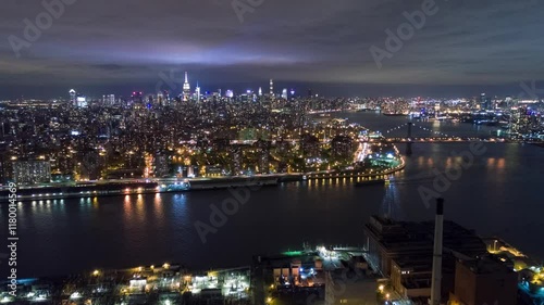 Wallpaper Mural NEW YORK, USA - JANUARY 5, 2025: Night view of Manhattan skyline with illuminated buildings and riverside reflections Torontodigital.ca