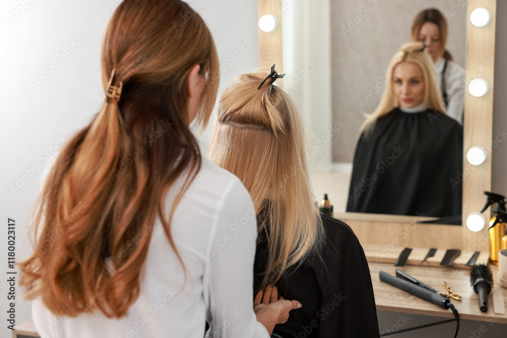 Fototapeta premium Hair cutting. Professional hairdresser working with client in salon