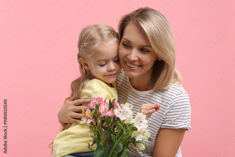 Little daughter congratulating her mom with bouquet of alstroemeria flowers on pink background. Happy Mother's Day Little daughter congratulating her mom with bouquet of alstroemeria flowers on pink background. Happy Mother's Day