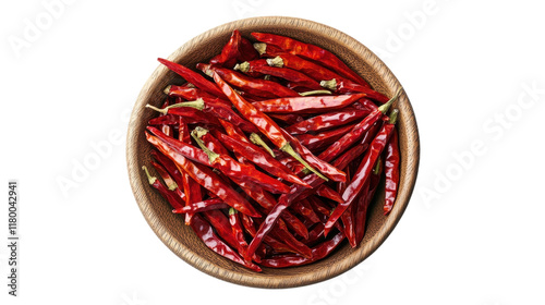 A vibrant collection of dried red chili peppers in a rustic wooden bowl on a kitchen table