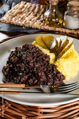 Fried black pudding with mashed potatoes. photo