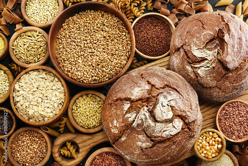 Whole grains concept. Colorful mix of grain varieties: oat and wheat, rice and millet, buckwheat and barley, quinoa and polenta. Food ingridients for healthy diet background, selective focus