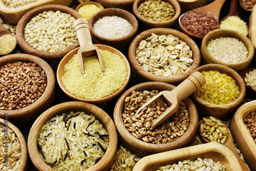 Colorful mix of grain varieties: oat and wheat, rice and millet, buckwheat and barley, quinoa and polenta. Food ingridients for healthy diet background, selective focus