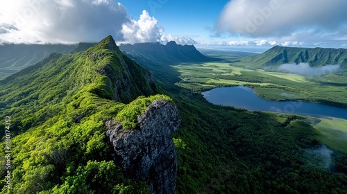 A view of a lush green valley with a lake in the middle of it