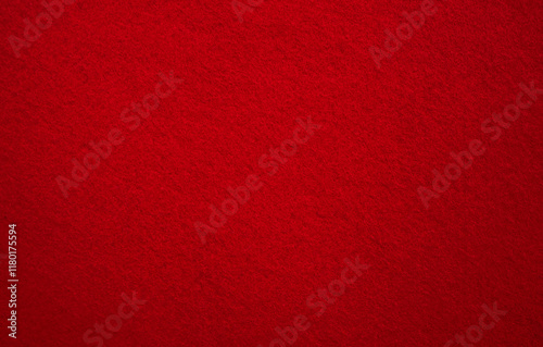 A photo of the texture of the red-colored fabric.Red felt fabric background.