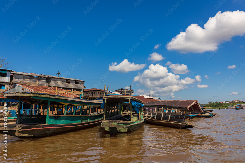 Belen neighborhood in Iquitos, Peru. It is presented as a sample of the true jungle culture. Here people travel in boats and live in wooden houses built on the Itaya River. Belen neighborhood in Iquitos, Peru. It is presented as a sample of the true jungle culture. Here people travel in boats and live in wooden houses built on the Itaya River.