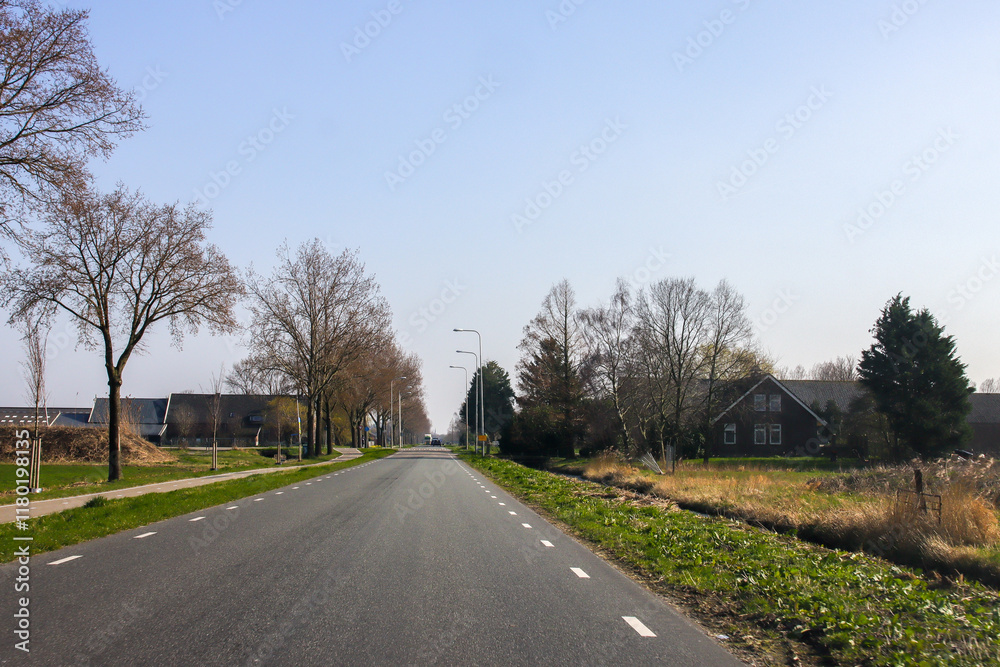 Fototapeta premium Main road Middelweg after harvest in the Zuidplaspolder where new village Cortelande will arise