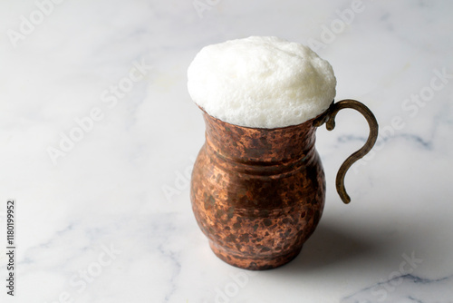 Obraz na płótnie Glass cup of Turkish traditional drink ayran , kefir or buttermilk made from yogurt, healthy food w salonie