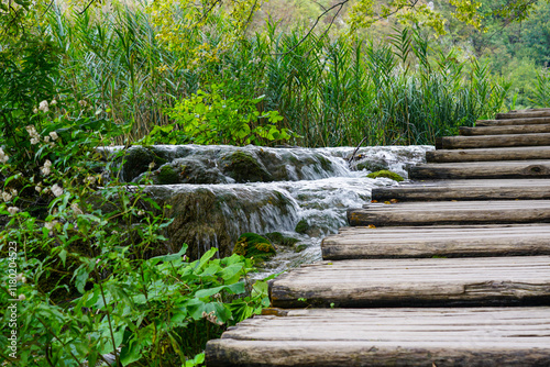 Low shutter speed shot of beautiful waterfall from boardwalk in Plitvice lakes national park