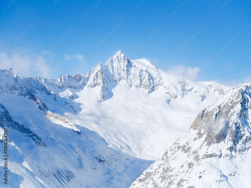 Winter mountain scene. High sharp rocks and snow. Cold weather and frost. View of the mountains. Photo for postcards, backgrounds, wallpapers. Winter mountain scene. High sharp rocks and snow. Cold weather and frost. View of the mountains. Photo for postcards, backgrounds, wallpapers.