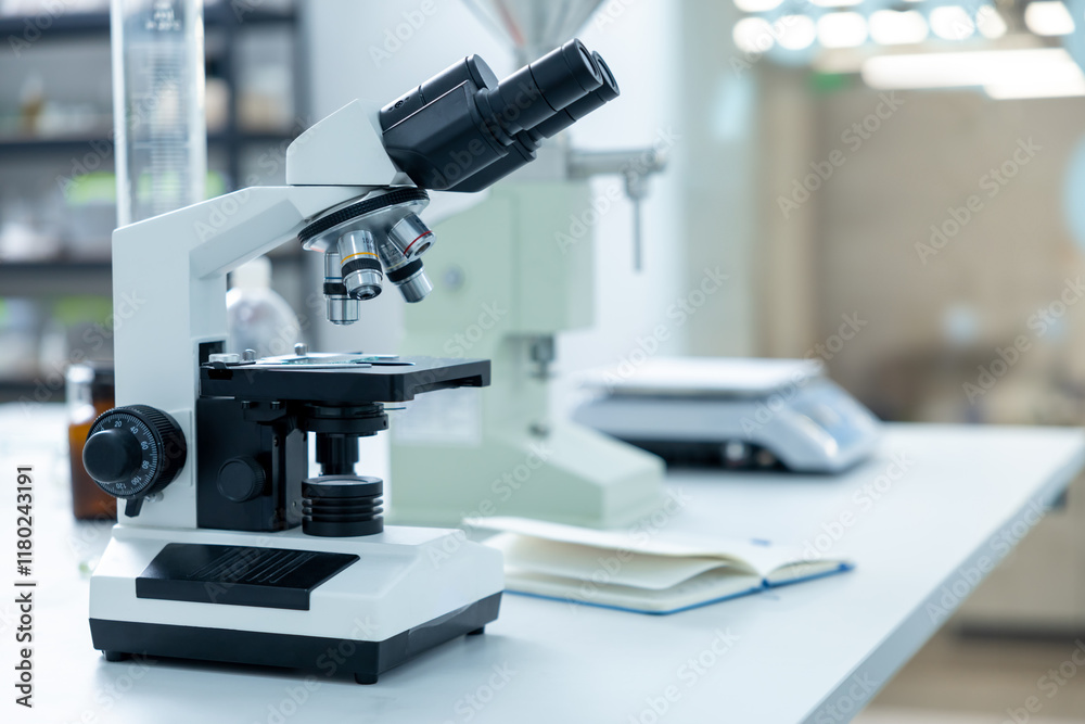 Scientist's microscope for magnifying samples and testing chemicals in lab