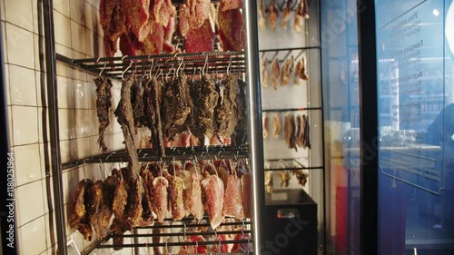 Meat and poultry hanging on curing racks
