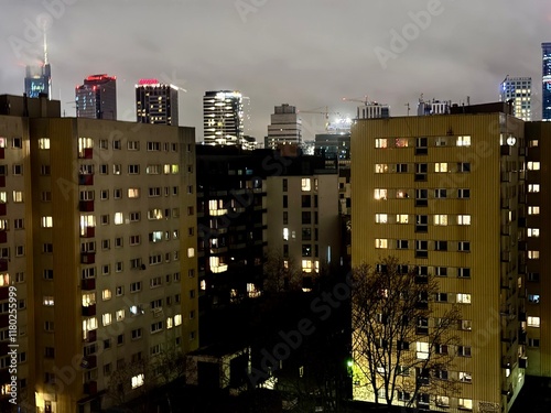 night view of skyscrapers in warsaw poland with its colorful lights on a winter evening with fog
