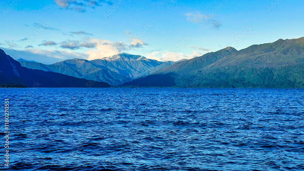 The shore of Lake Kaniere in the West Coast NZ The shore of Lake Kaniere in the West Coast NZ