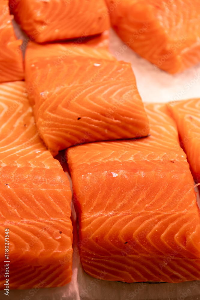 Fresh salmon pieces at the market. Raw material for sushi. Fresh salmon pieces at the market. Raw material for sushi.