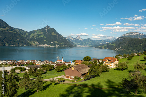 Switzerland village. Mountains landscape. Switzerland Alps. Alpine pasture in mountains. Mountains in the Swiss Alps. Landscape with green fields in Switzerland.
