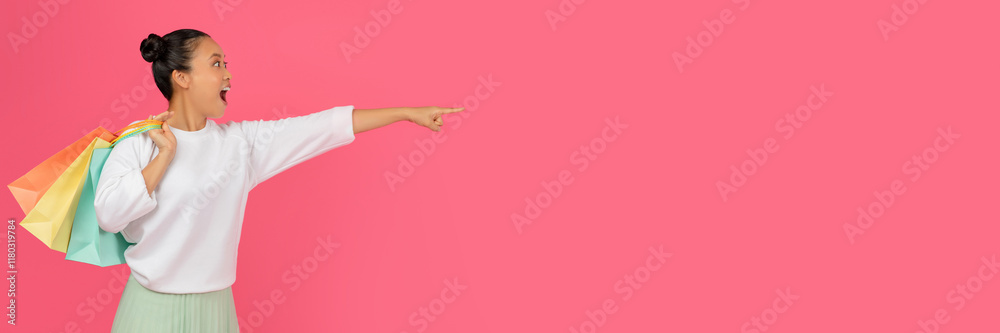 Check This. Amazed Asian Lady Holding Shopping Bags And Pointing Aside At Copy Space, Excited Young Korean Shopaholic Lady Demonstrating Free Place For Advertisement, Standing On Pink Background Check This. Amazed Asian Lady Holding Shopping Bags And Pointing Aside At Copy Space, Excited Young Korean Shopaholic Lady Demonstrating Free Place For Advertisement, Standing On Pink Background